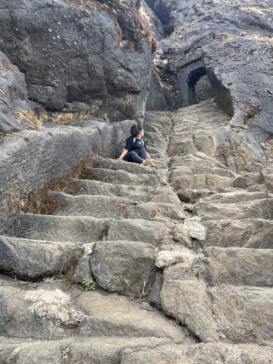 The rock-cut stairs on Salher, worn smooth in the centre, leading up towards one of the gates